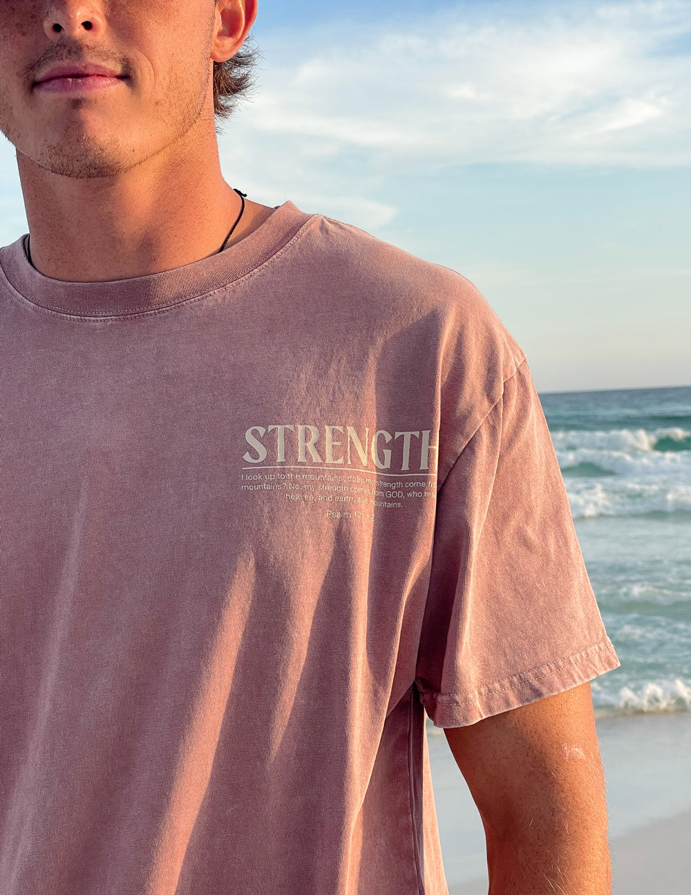 Unisex tee front with 'STRENGTH' text, dusty rose