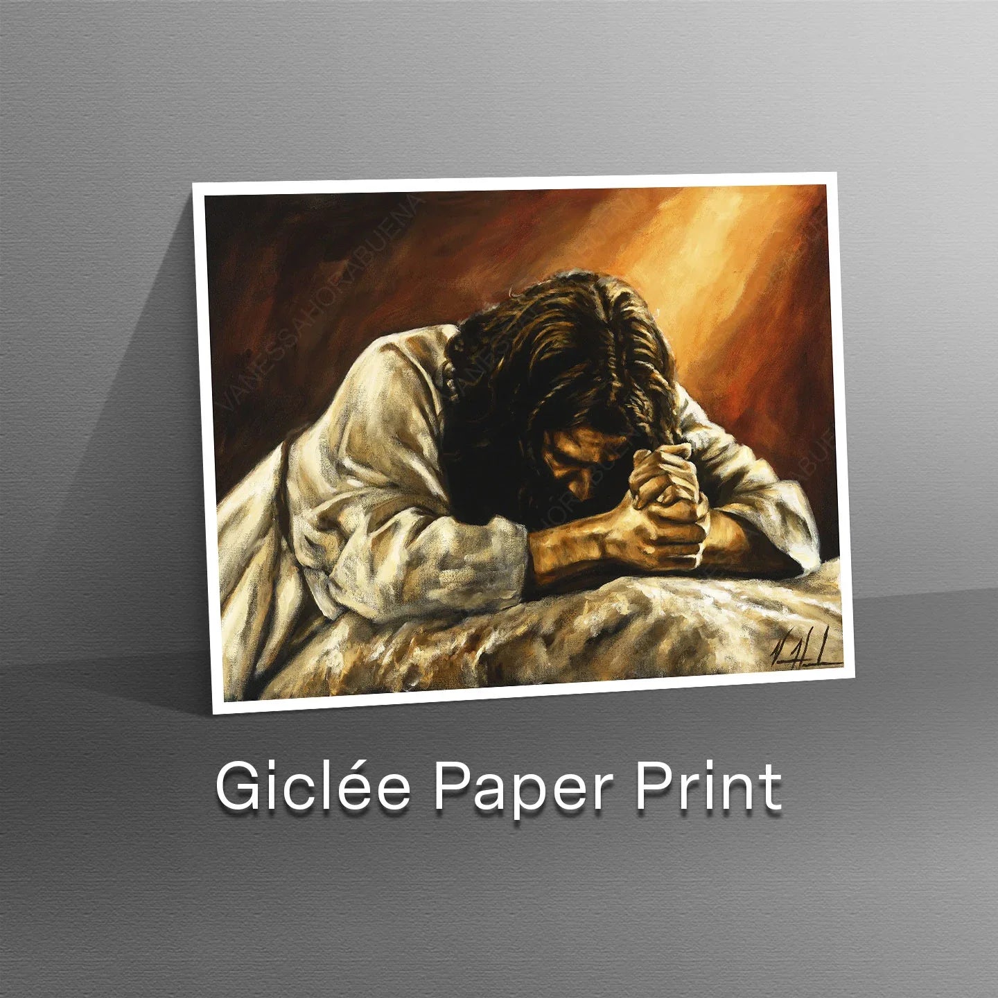 Giclée paper print in white frame showing a praying man with clasped hands