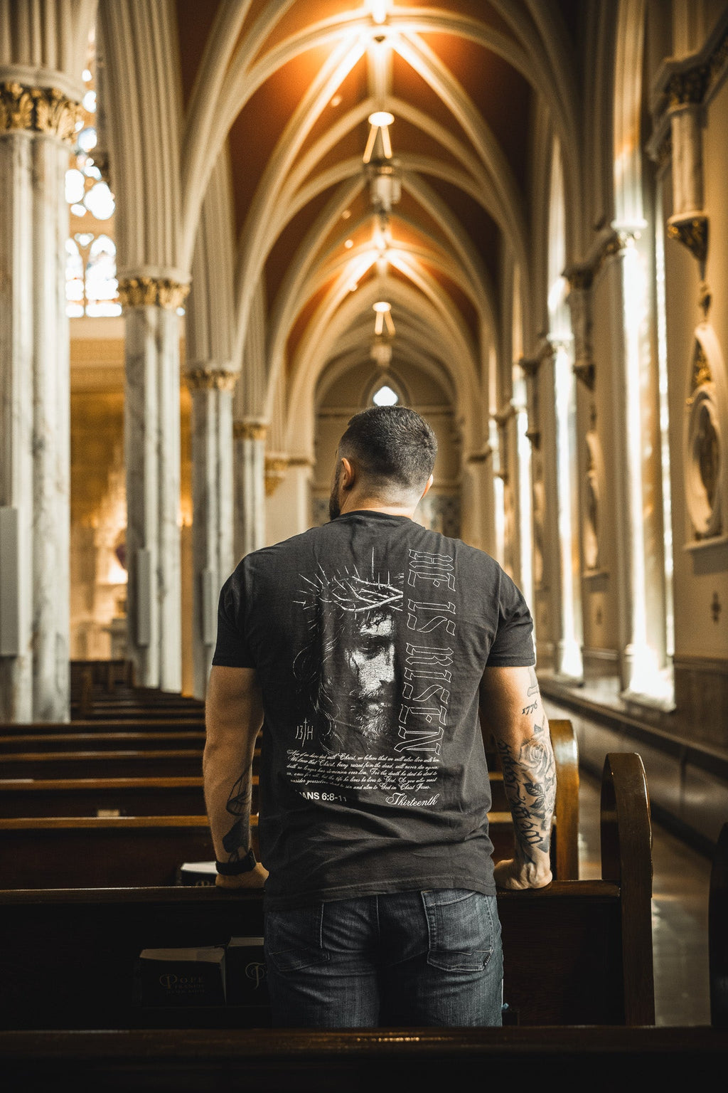 Black graphic t-shirt with back portrait and vertical symbol design