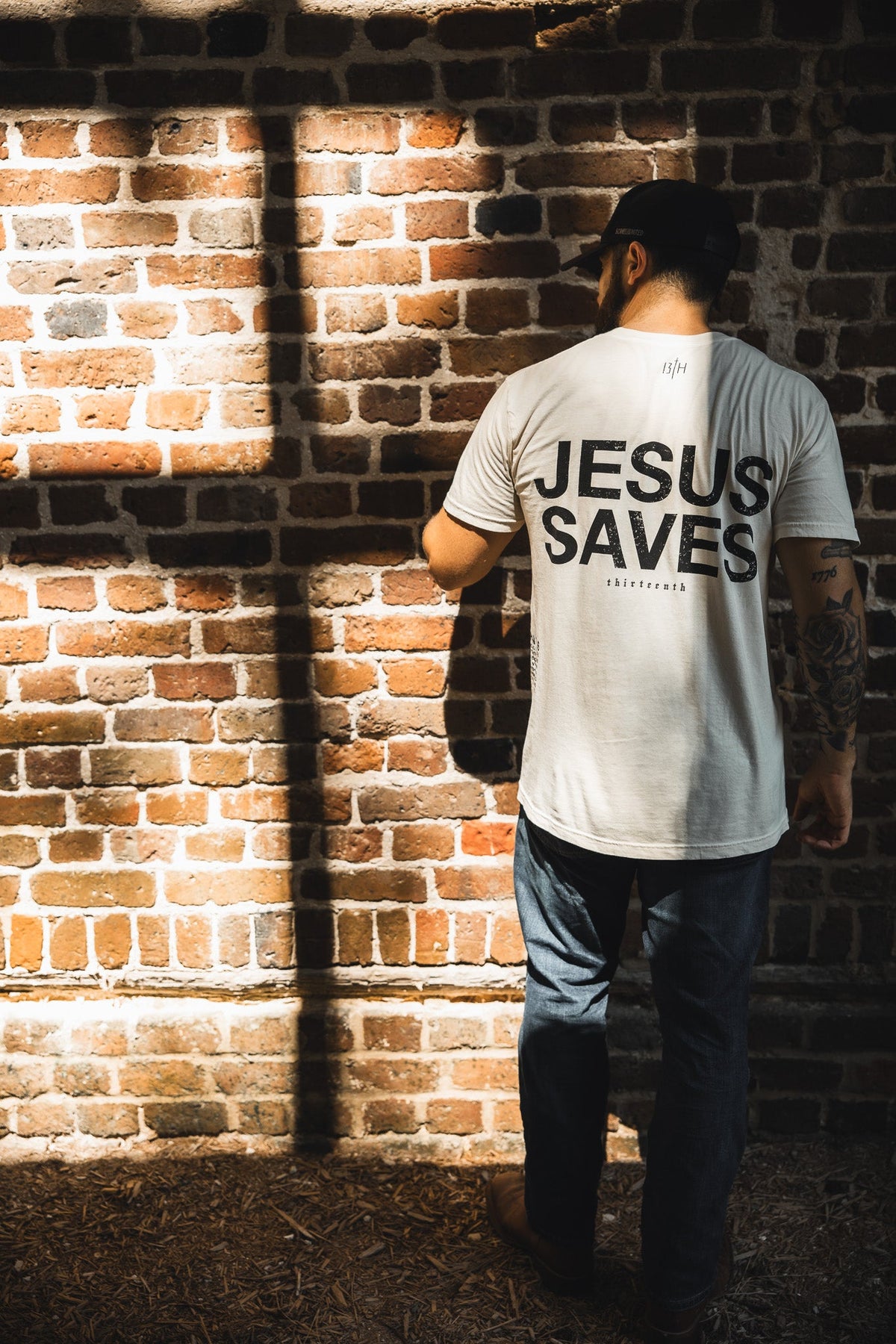 Ivory graphic T-shirt, back print with large “JESUS SAVES” text
