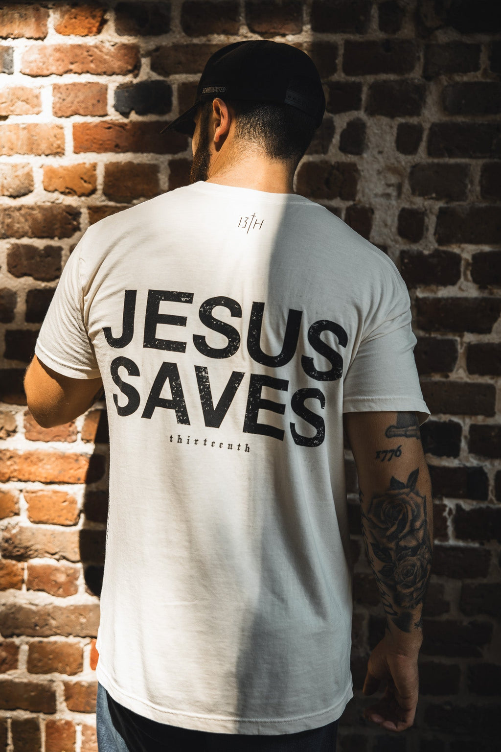 Ivory graphic T-shirt, back “JESUS SAVES” print with small ITH mark