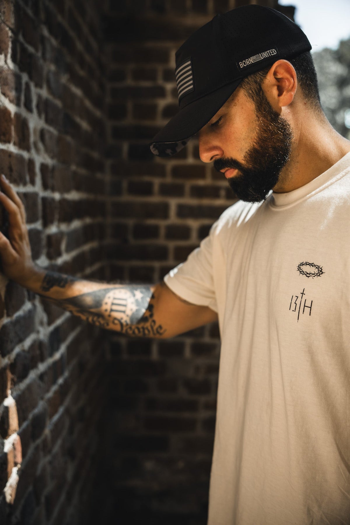 Ivory graphic T-shirt, small chest emblem and ITH detail