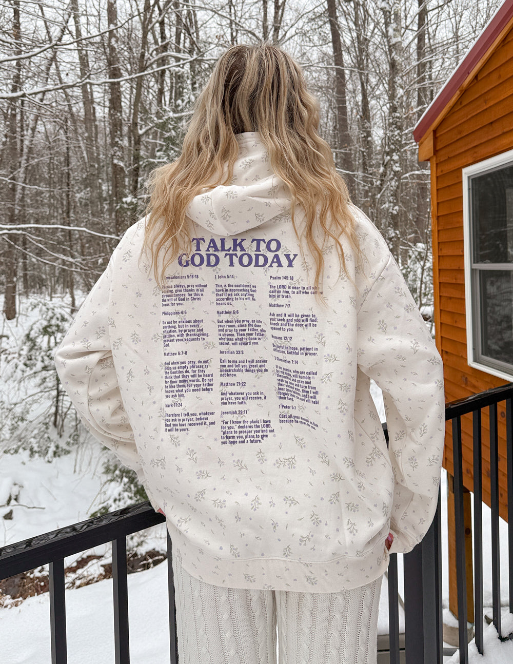 Unisex cream hoodie with allover wildflower print, back “Talk to God Today” text graphic