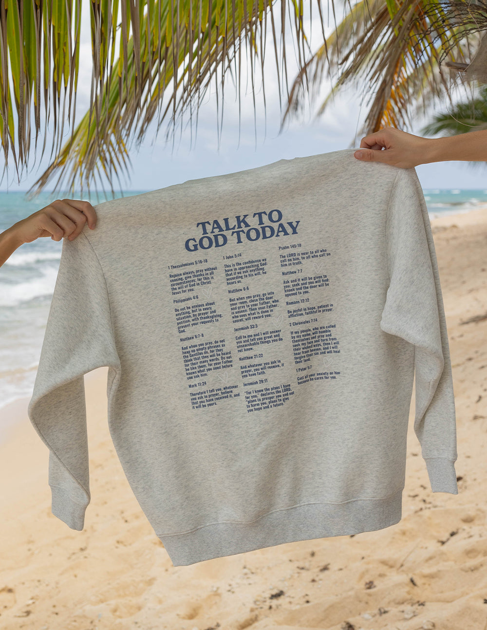 Light heather gray crewneck sweatshirt with “Talk to God Today” back text list.