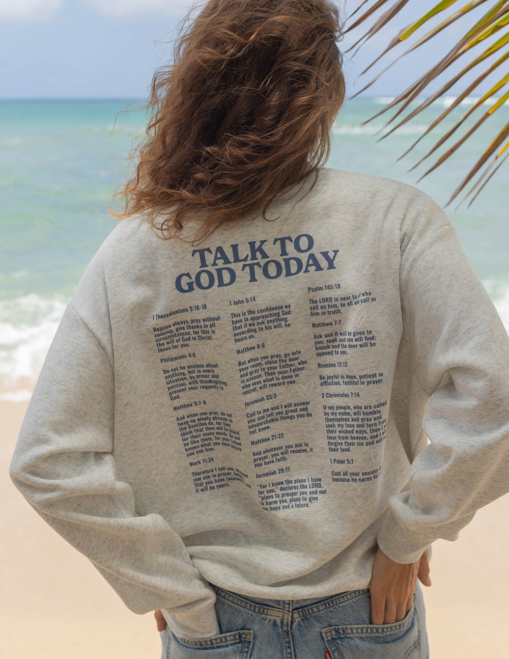 Light heather gray crewneck sweatshirt with “Talk to God Today” back text list.