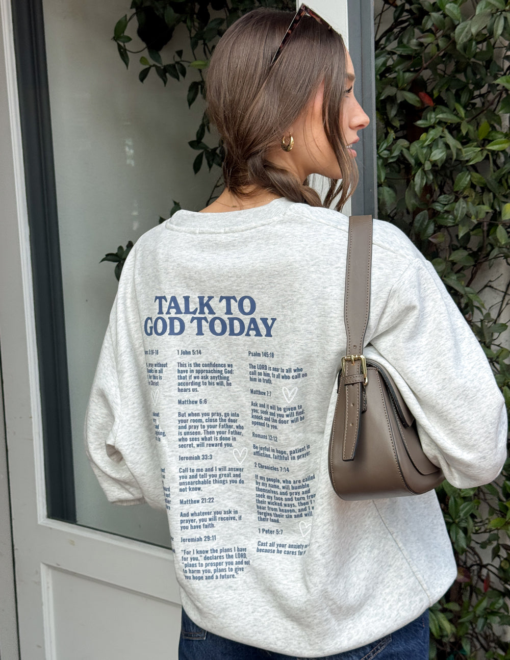 Light heather gray crewneck sweatshirt with “Talk to God Today” back text list.