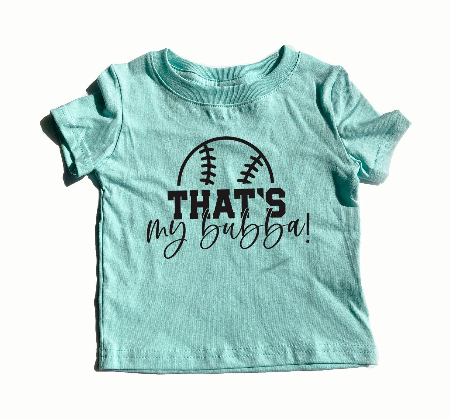 Teal kids graphic T-shirt with football logo and text "THAT'S my bubba!"