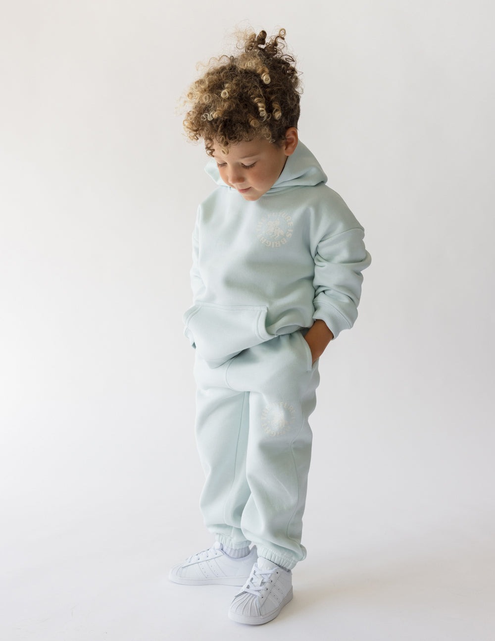 Light mint kids hoodie with hood and long sleeves, front graphic on chest