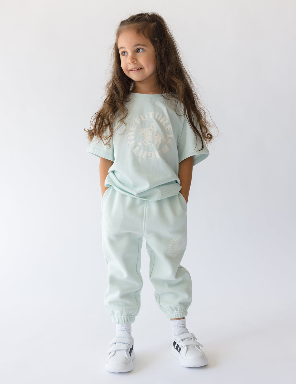 Kids mint sweatpants with elastic waistband, cuffed ankles, and FUTURE IS BRIGHT print