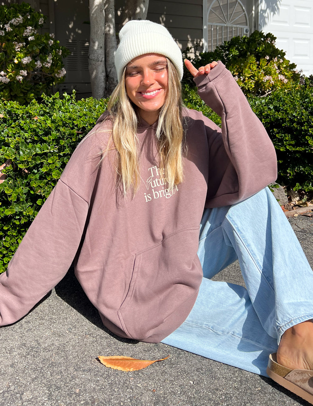 Unisex mauve hoodie with hood; 'The Future is bright' chest graphic and ribbed cuffs.