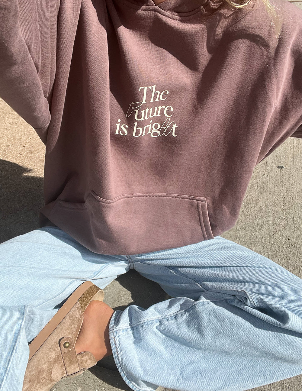 Mauve unisex hoodie with 'The Future is bright' chest print and kangaroo pocket.