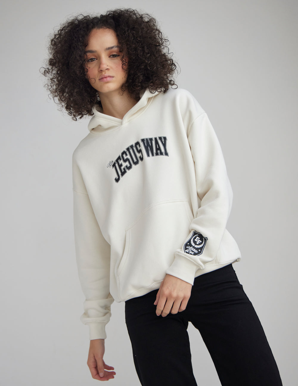 Unisex white hoodie with “JESUS WAY” front text and sleeve crest patch