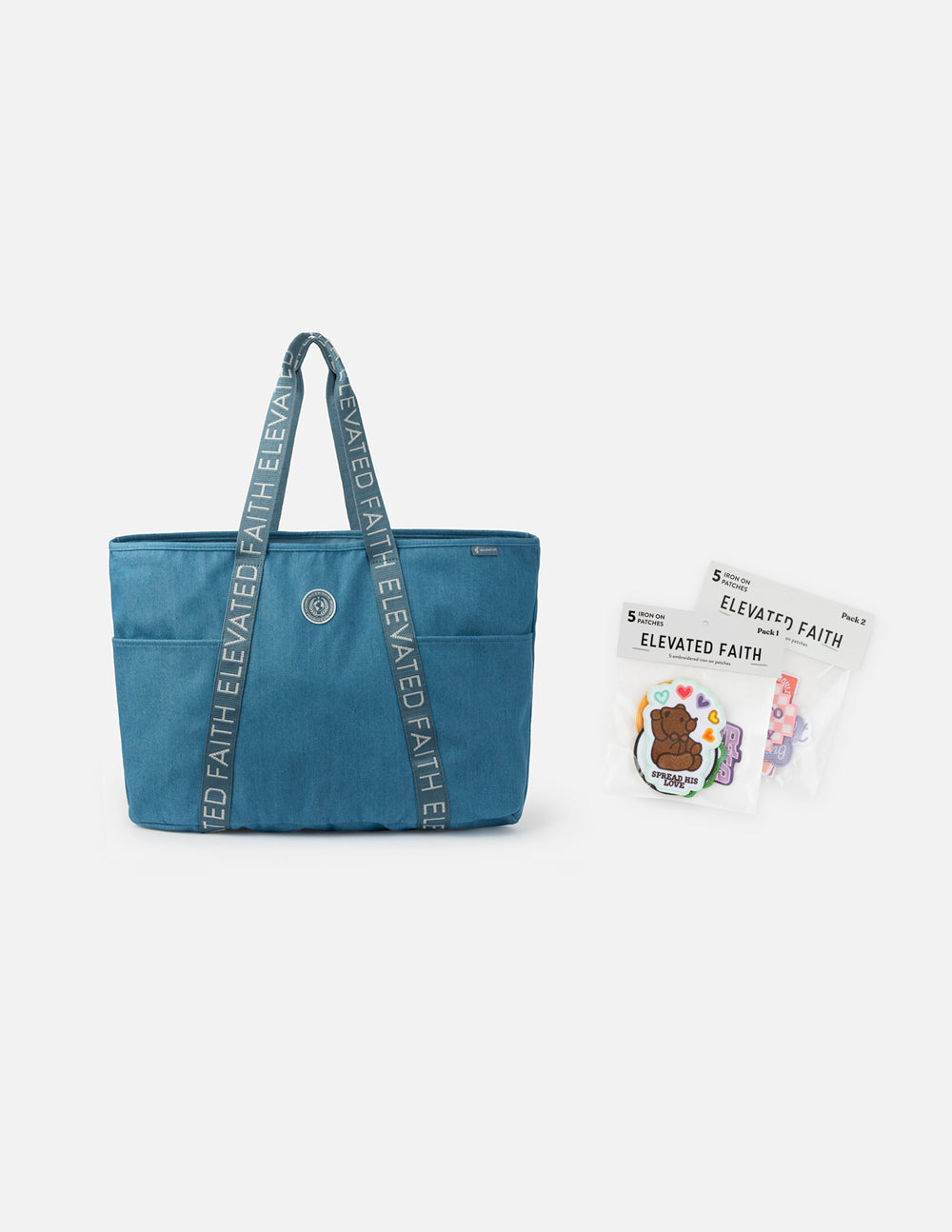 Blue denim tote bag with front pocket and stacked logo text on handles