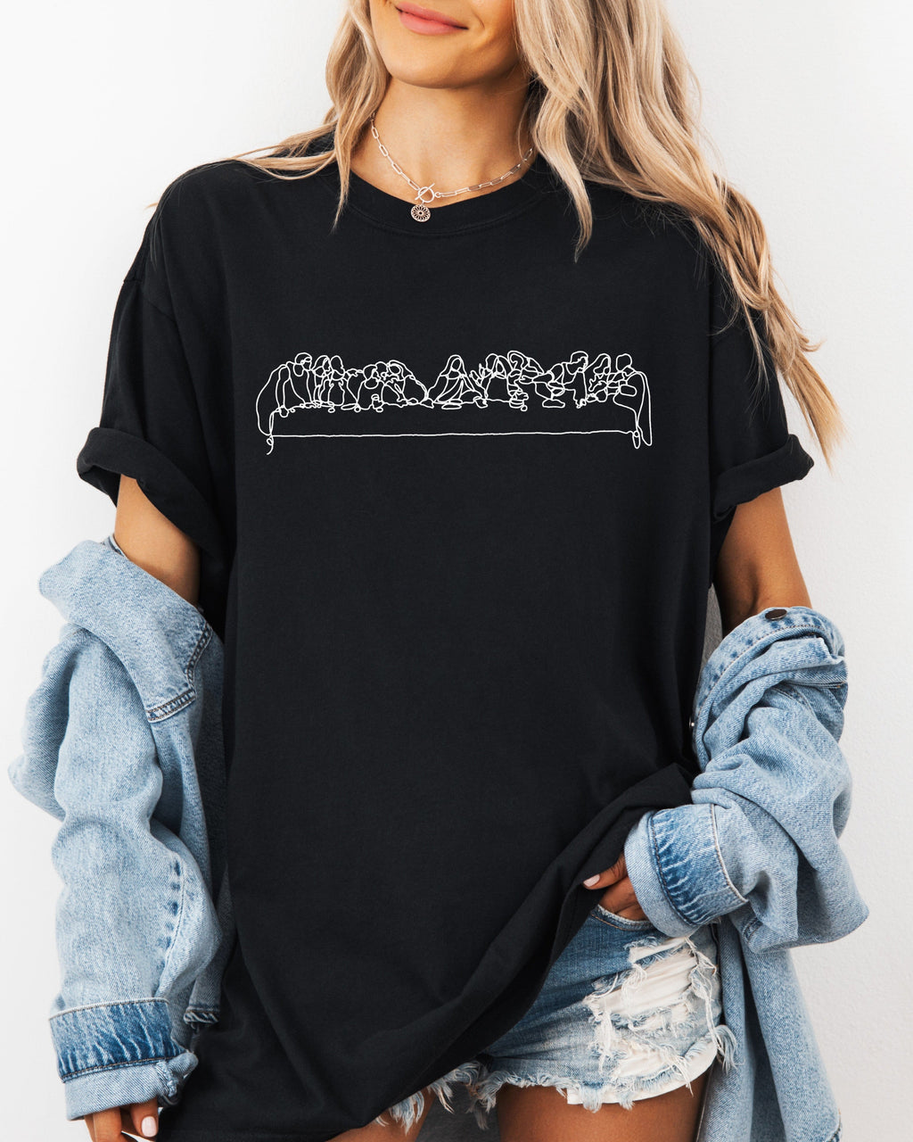 Black Christian graphic T-shirt with Last Supper line art