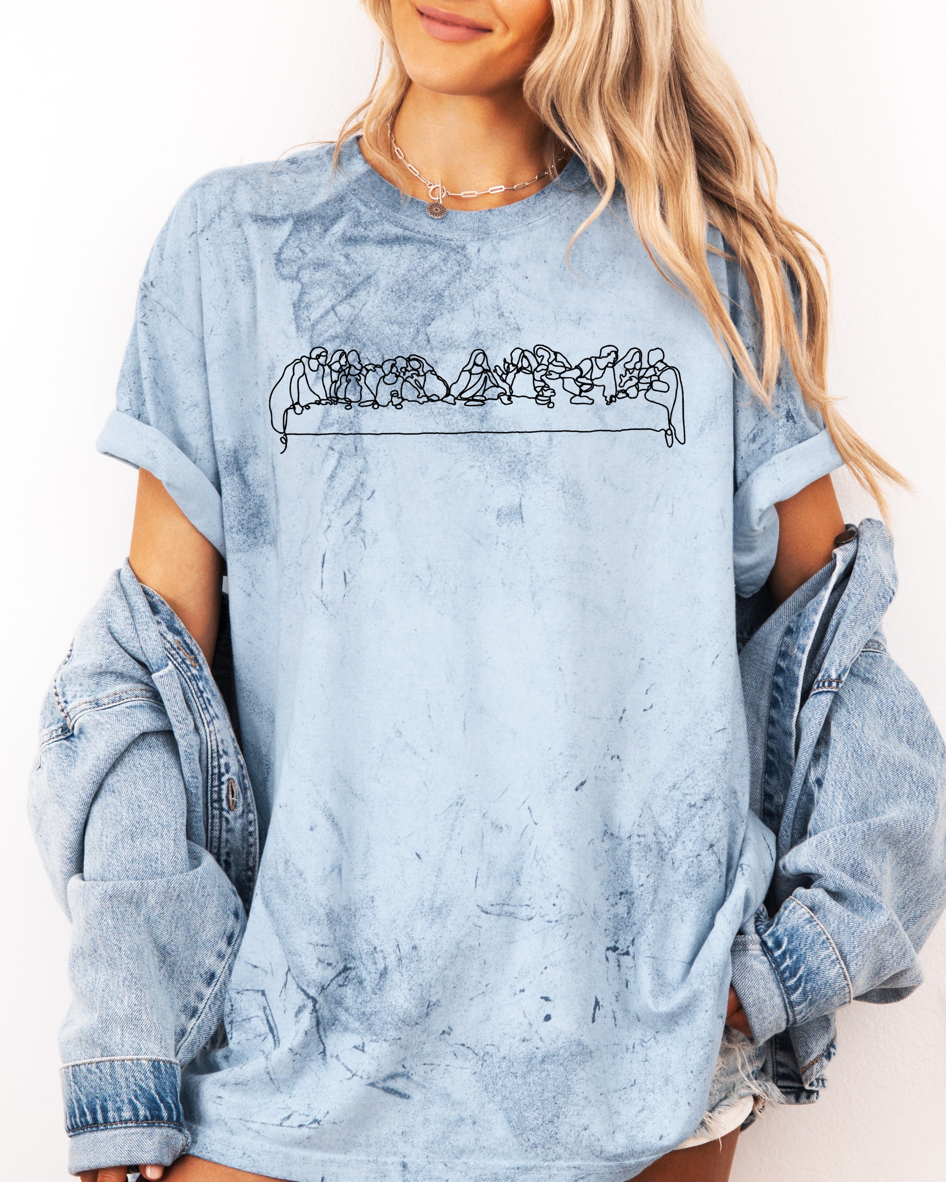 Unisex light blue T-shirt with white line Christian scene graphic across chest