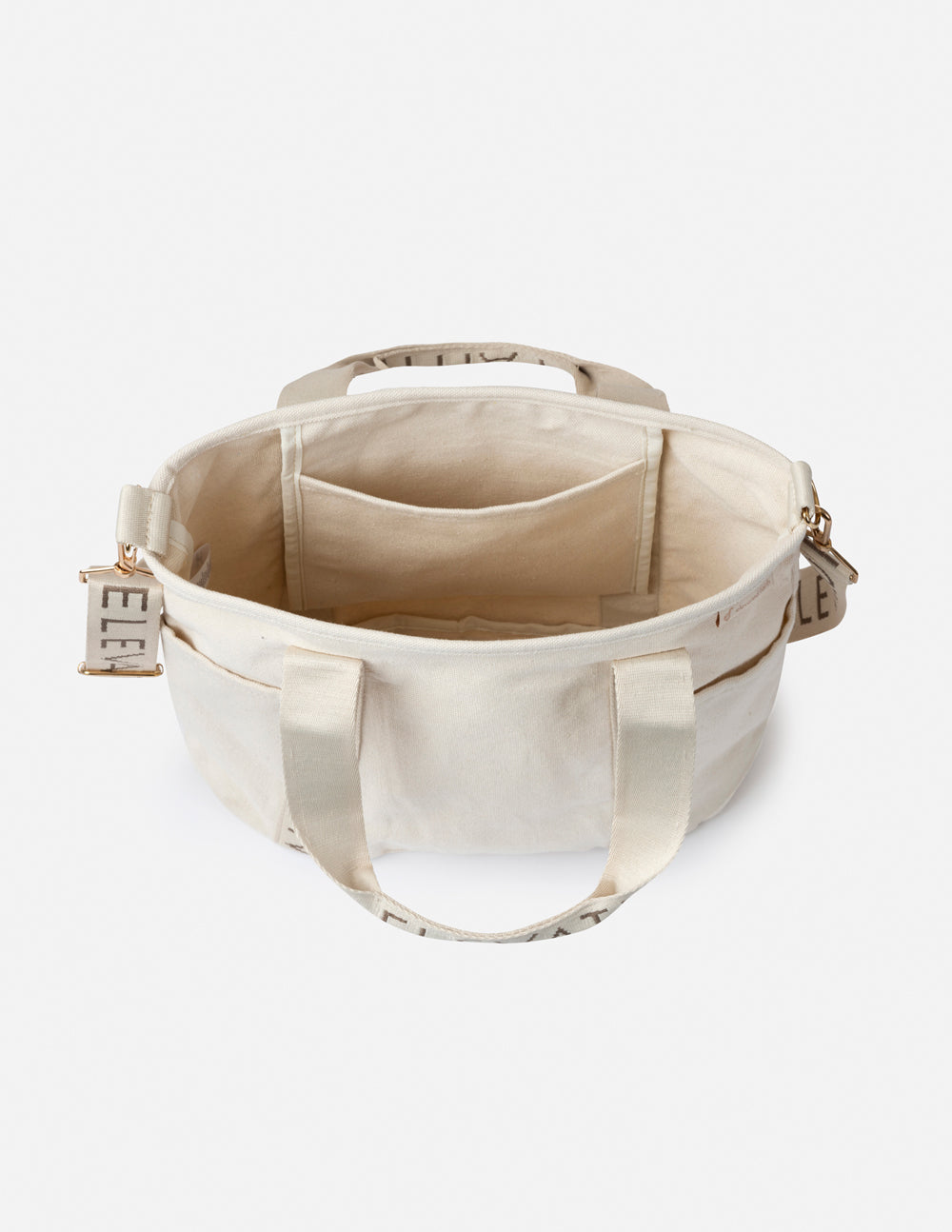 Cream mini tote with open top and inner pockets, featuring “ELEVATED FAITH” side tabs