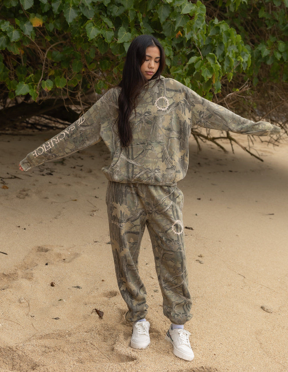 Unisex camouflage hoodie with front hood and large circular back graphic