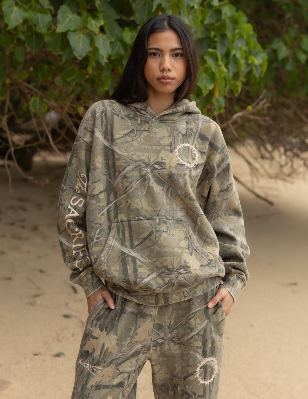 Unisex camouflage pullover hoodie with front pouch pocket and circular chest graphic