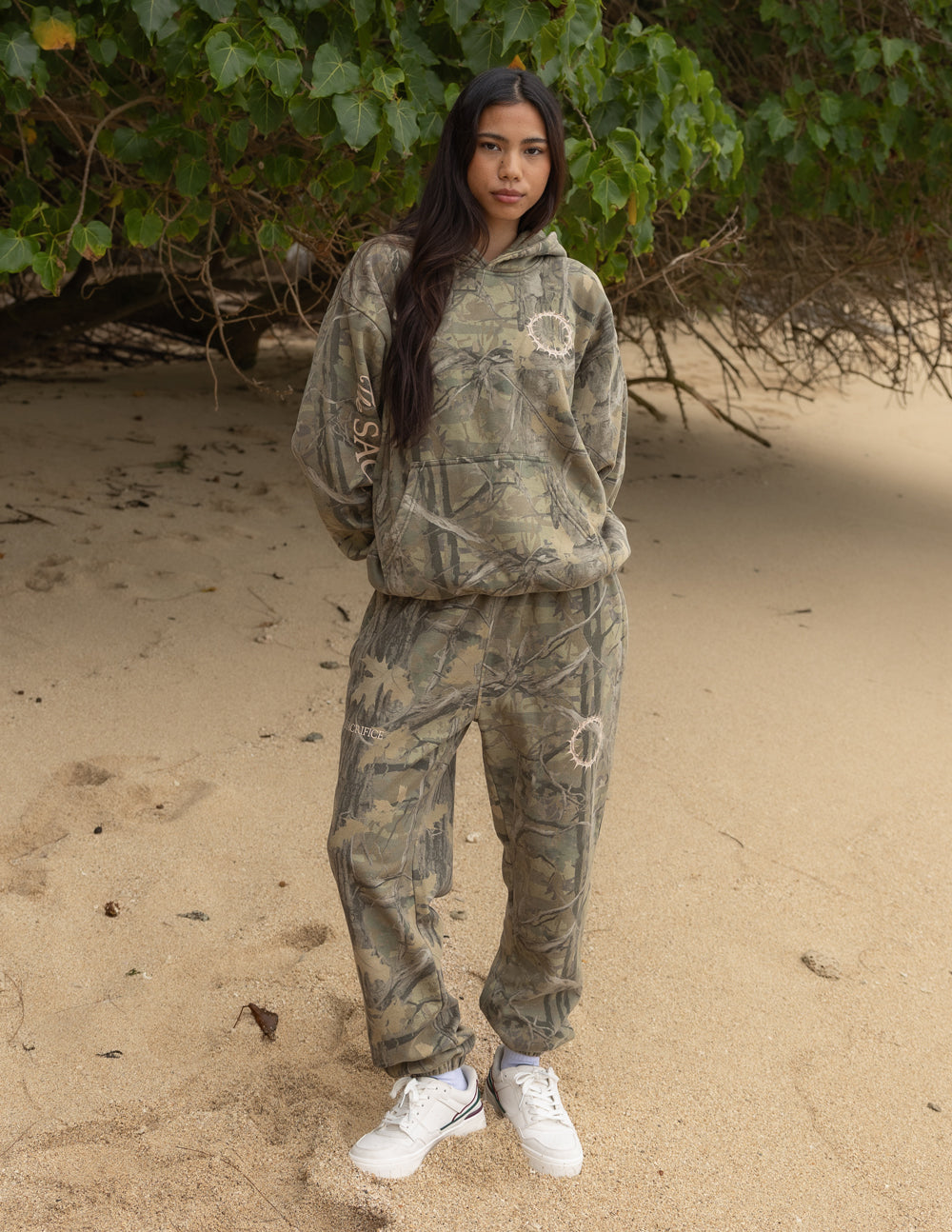 Camo unisex sweatpants with elastic waistband and white circle graphic patches
