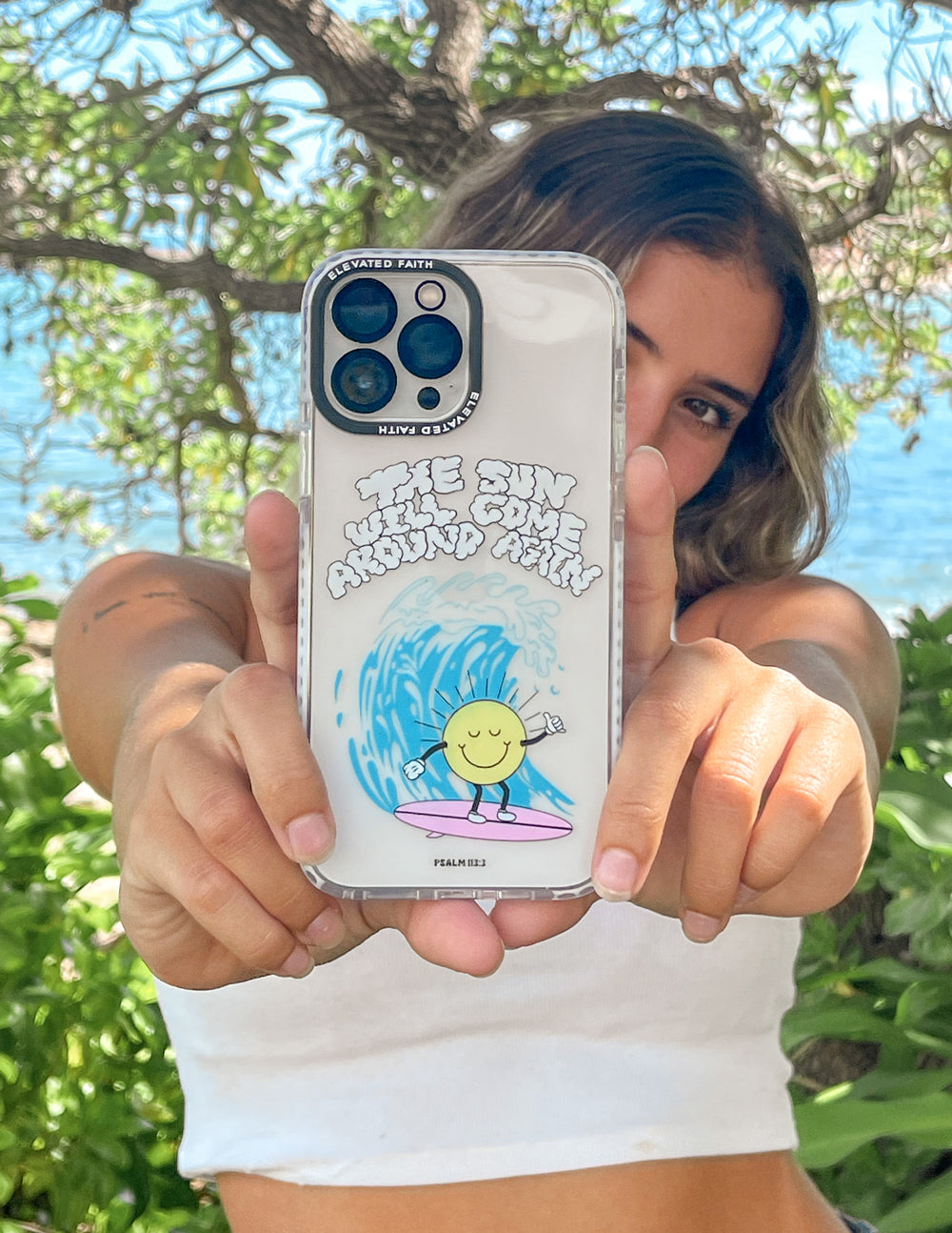 Transparent phone case with smiling sun and blue wave graphic