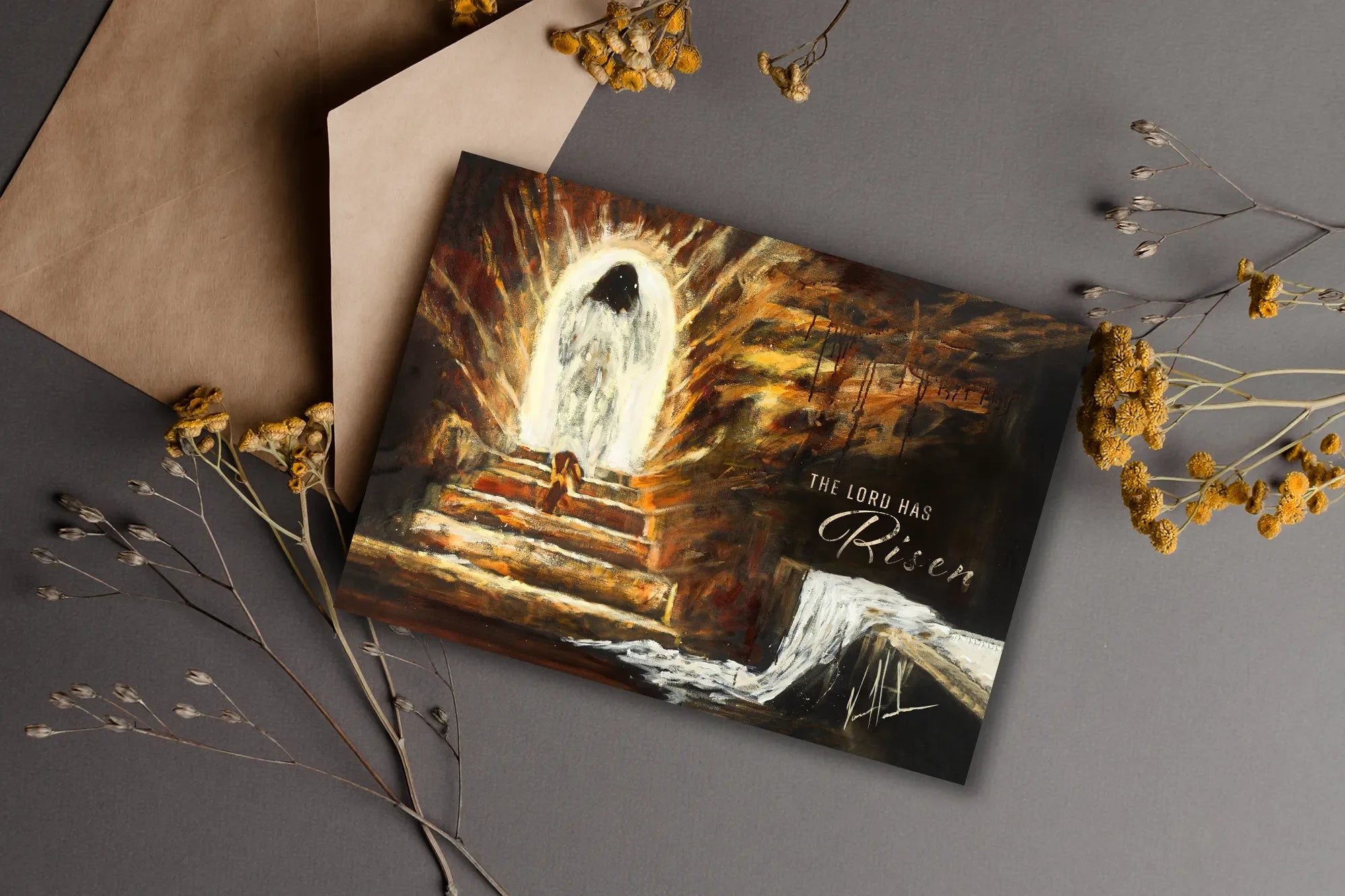 Easter greeting card with empty tomb illustration and 'The Lord is Risen' text.
