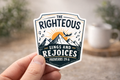 Shield sticker with “The Righteous Sings and Rejoices,” Proverbs 29:6, mountains and birds