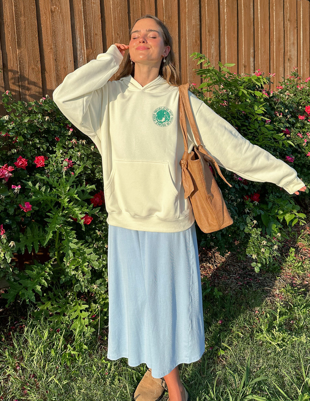 Light cream unisex hoodie with green chest logo and hood