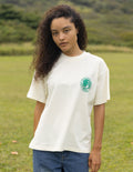 Unisex T-shirt in white with small green circular chest graphic logo