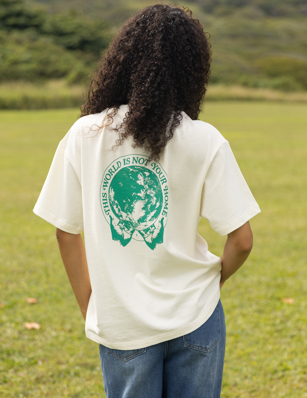 Unisex T-shirt in white with large green circular back graphic logo
