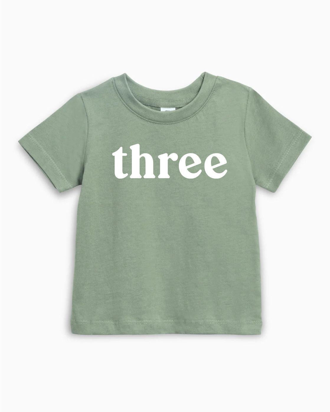 Kids organic cotton T-shirt in green with white 'three' text on front