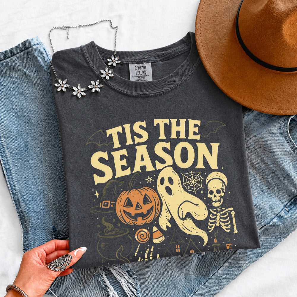 Black crewneck T-shirt with “Tis the Season” Halloween graphic; floral neckline detail