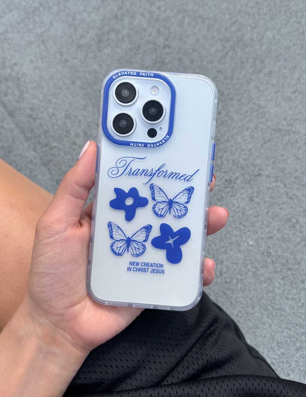Clear phone case with blue butterflies and cross graphic, slim protection edges