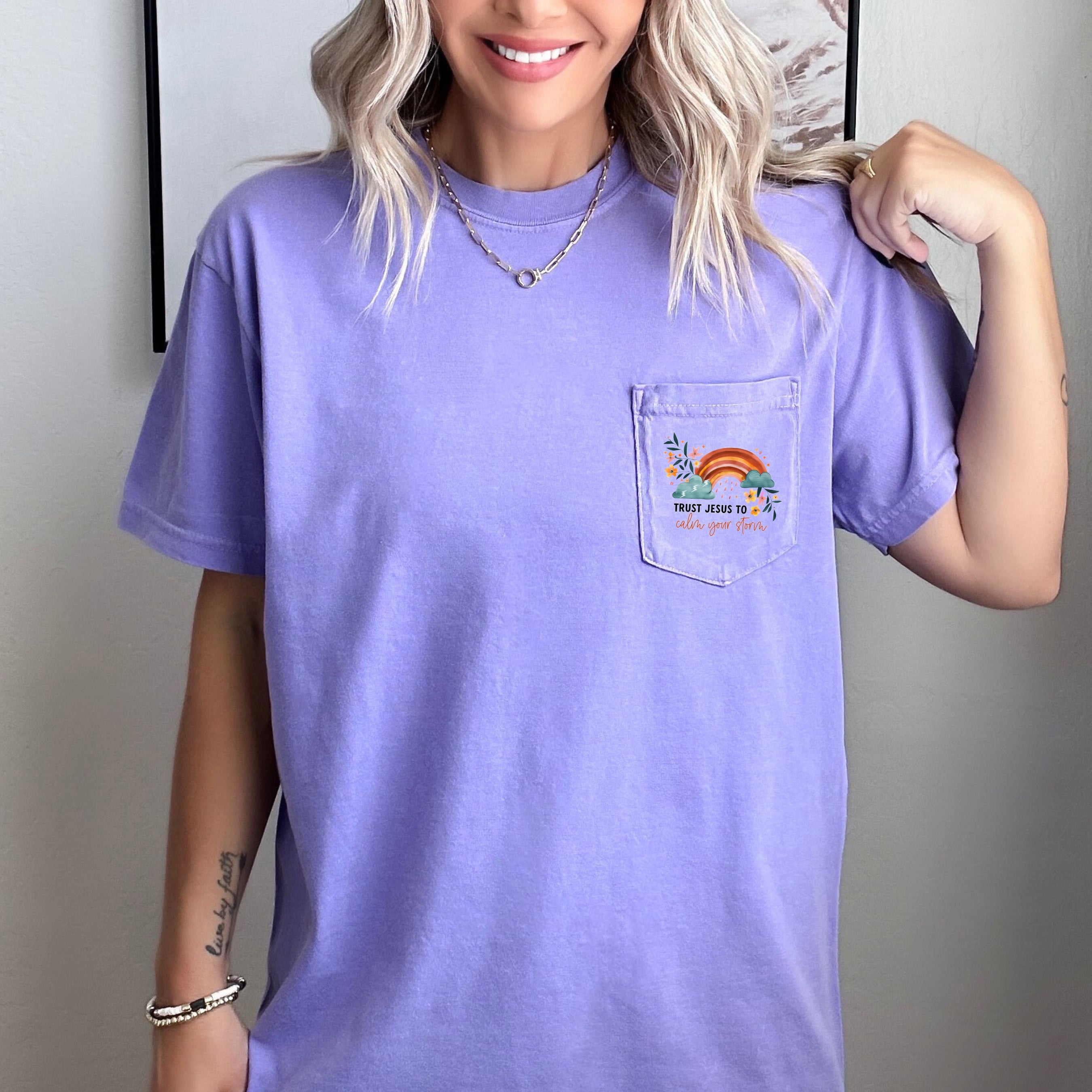Lavender pocket T-shirt with small chest graphic and crew neckline