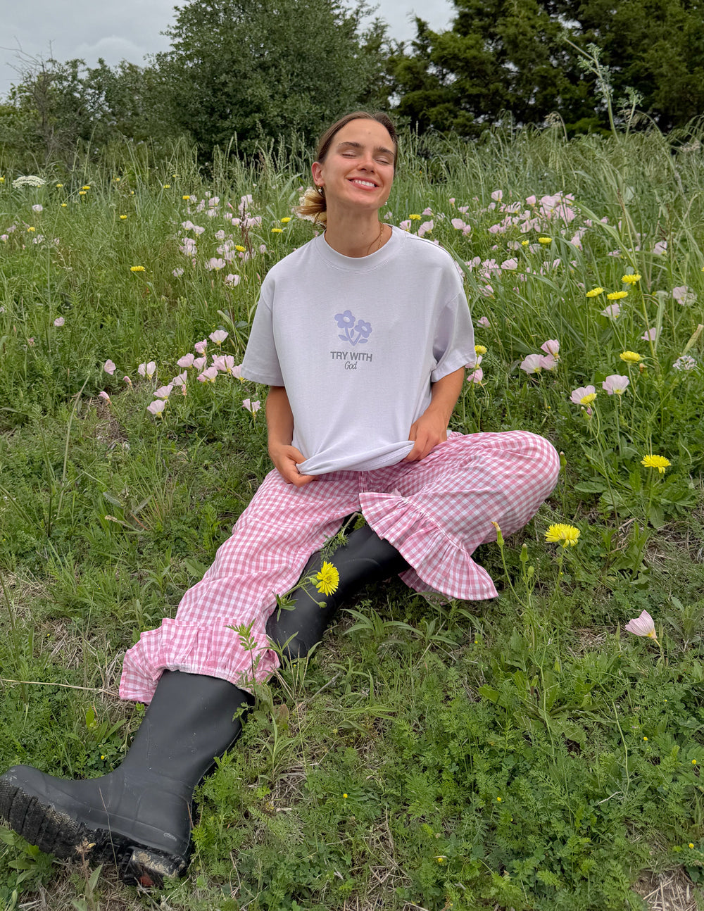 Light lavender unisex T-shirt with small centered chest logo and text