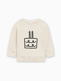 Cream baby pullover sweatshirt with birthday cake graphic on front
