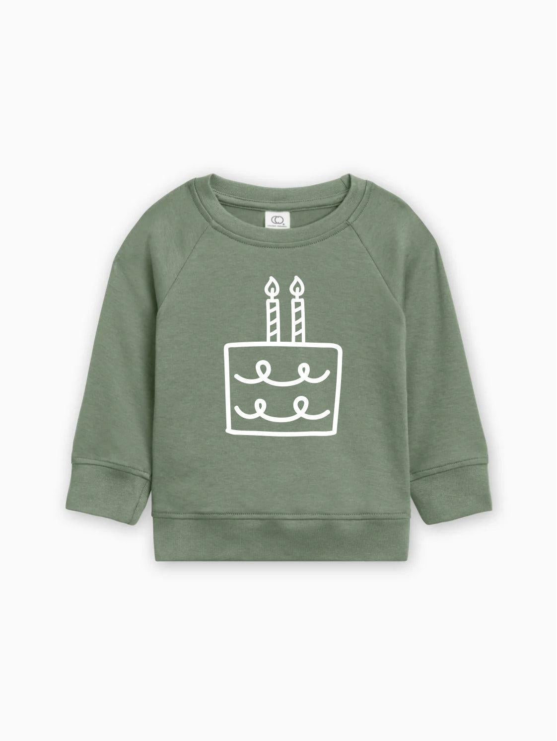 Green baby pullover sweatshirt with birthday cake graphic on front