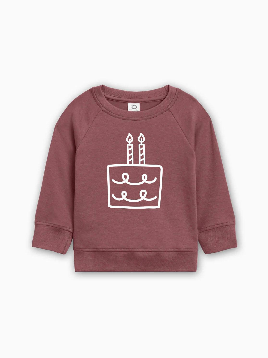 Maroon baby pullover sweatshirt with birthday cake graphic on front