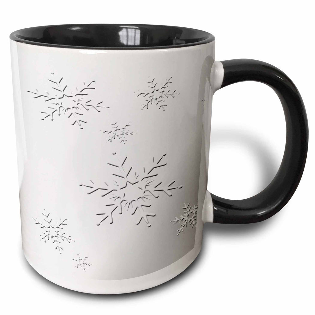 Two-tone mug with black rim and handle; white body with black snowflake design.