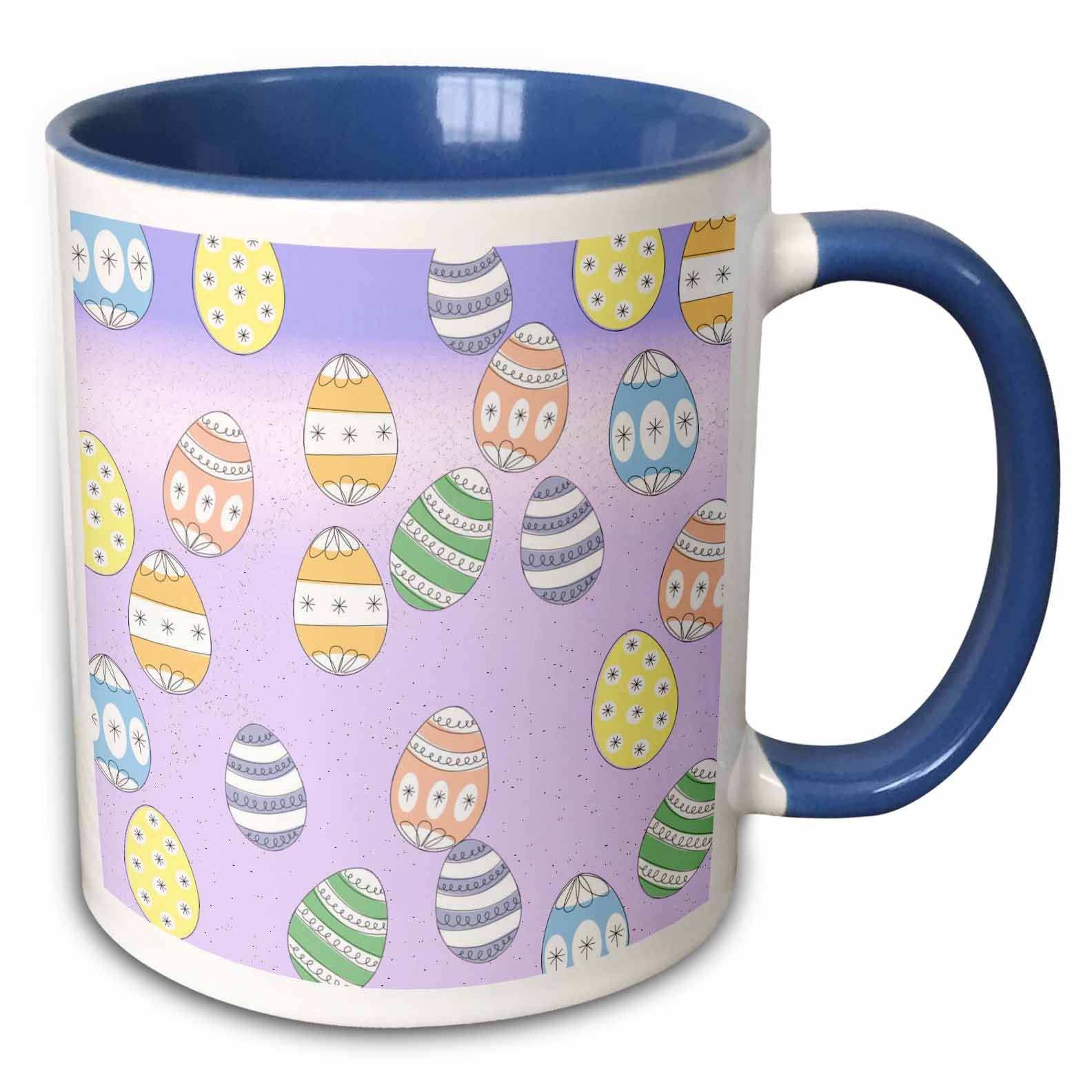 Easter egg pattern mug with blue handle and rim, white body and purple background