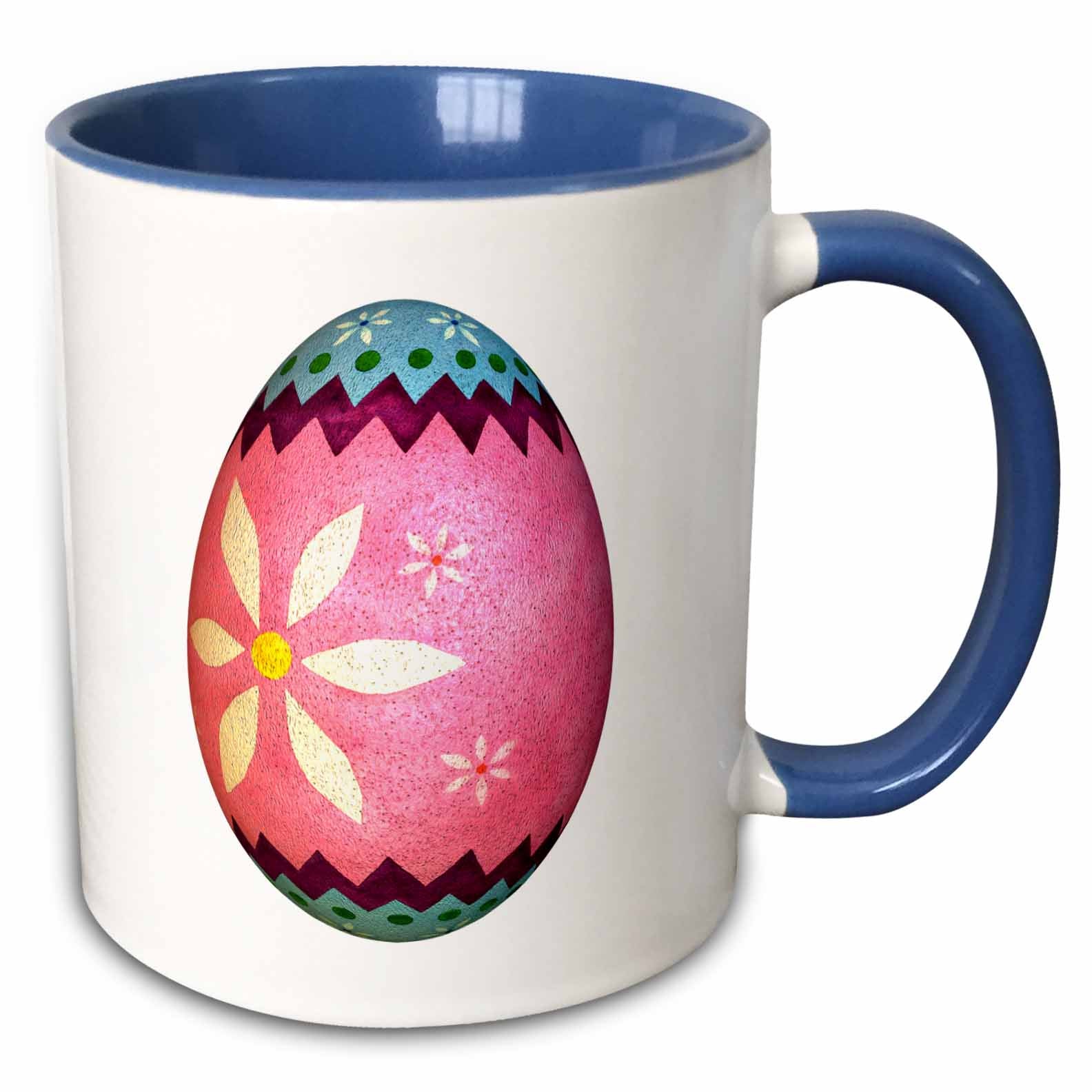 White mug with blue rim/handle; pink Easter egg floral graphic