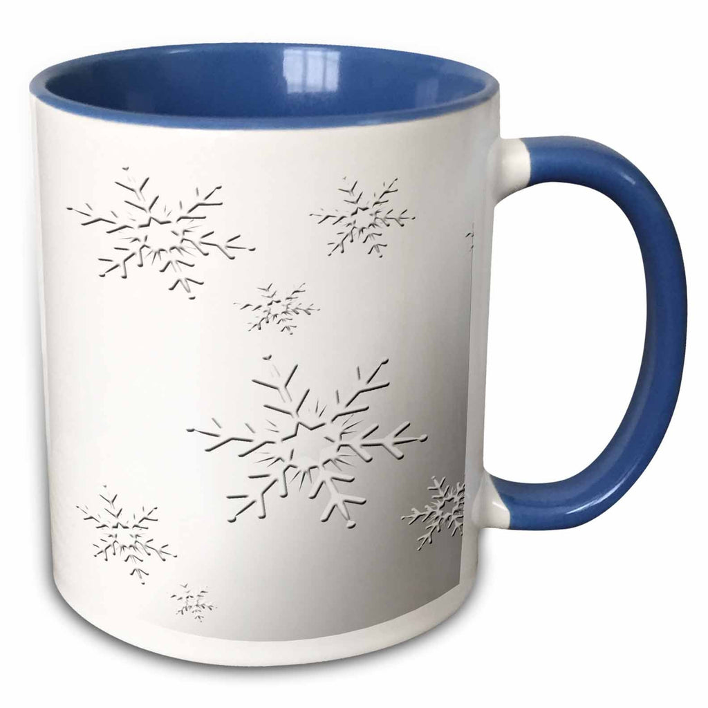 Two-tone blue and white mug with black snowflake pattern and right-side handle
