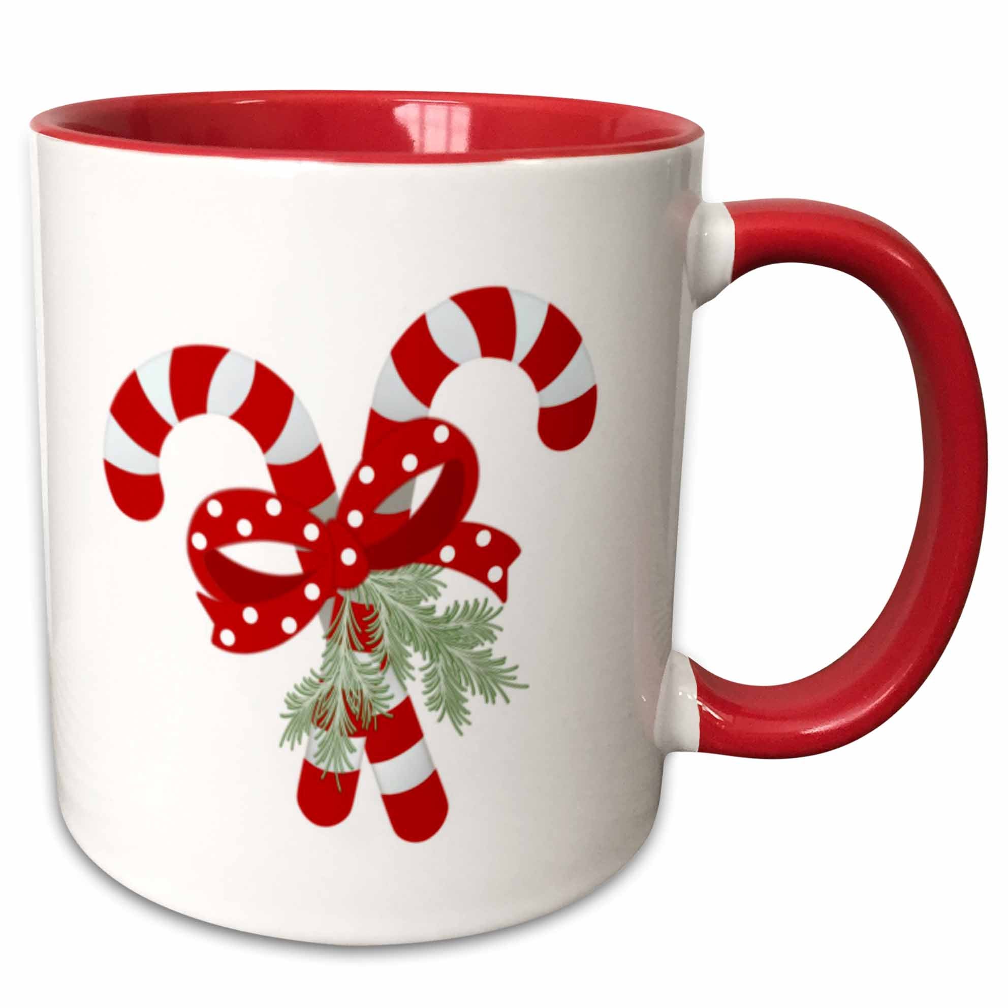 Red two-tone ceramic mug with crossed peppermint candy cane graphic and pine sprig