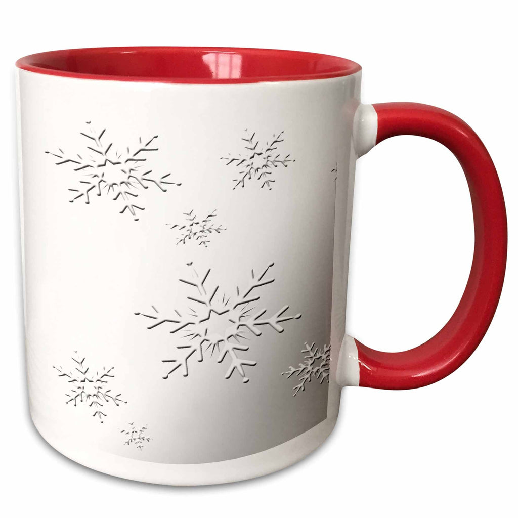 Two-tone red and white mug with black snowflake pattern and right-side handle