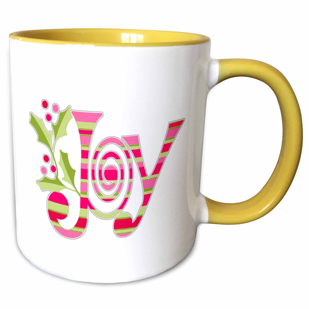 Two-tone ceramic mug with yellow interior and handle, featuring pink-and-green “Joy” design