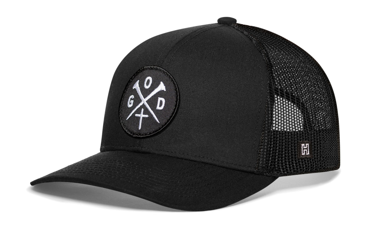 Black trucker snapback cap with circular 10xD cross logo patch and mesh sides