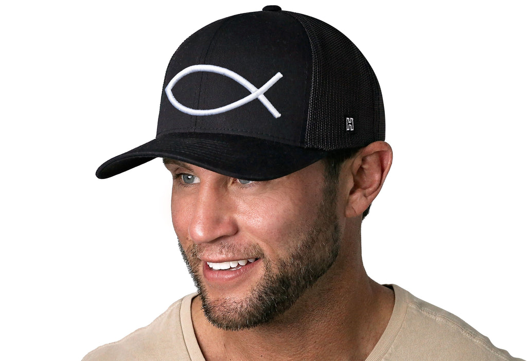 Black trucker cap with white ichthys fish logo and snapback