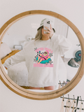 Light gray crewneck sweatshirt with colorful cartoon holiday graphic on chest