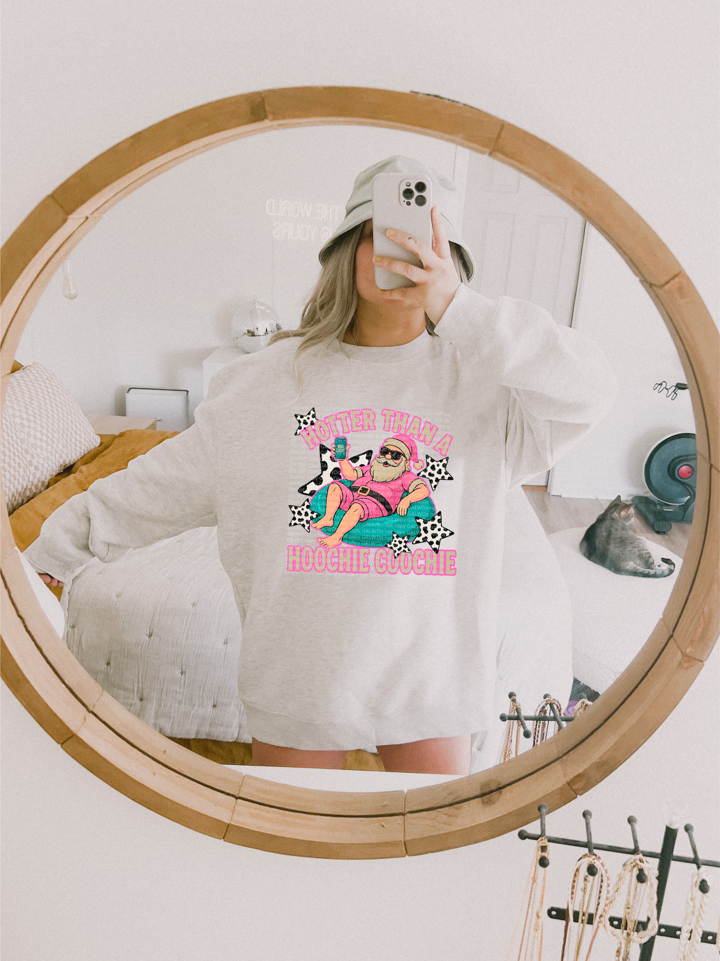 Light gray crewneck sweatshirt with colorful cartoon holiday graphic on chest