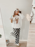 White sweatshirt with Christmas lights Highland cow reindeer graphic