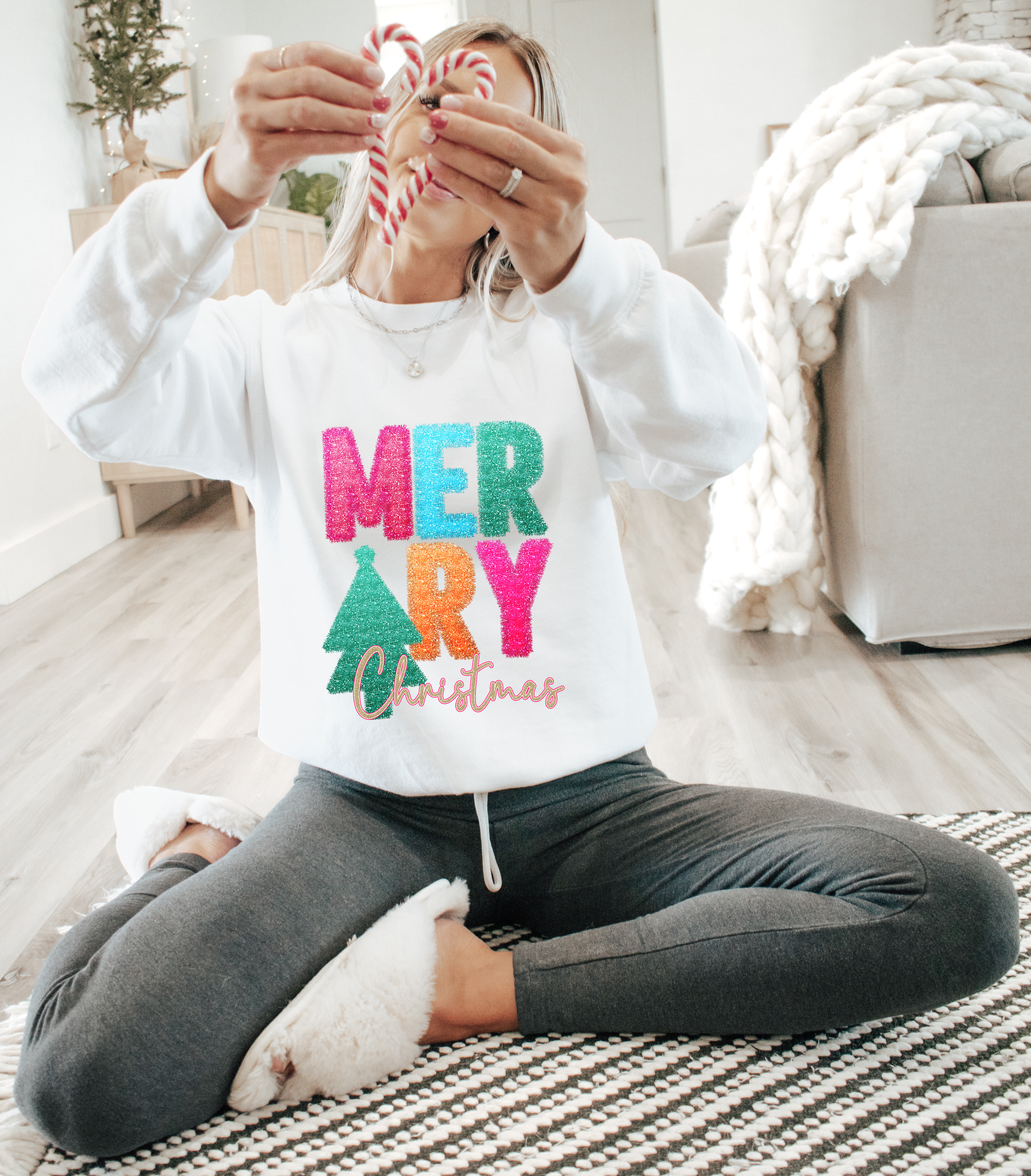 White long-sleeve crewneck with glitter 'Merry Christmas' tinsel graphic and tree